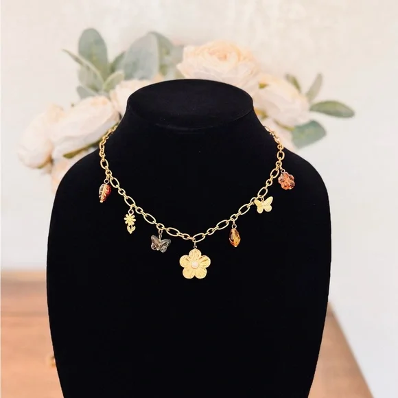 Charming Gold Necklace with Floral and Butterfly Accents - Picture 4 of 5